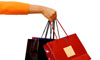 una mano con borse da shopping