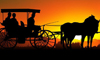 Una carrozza d'epoca con il tramonto